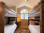 Upstairs bunk room has 1 set set of queen bunks and 1 set of twin bunks